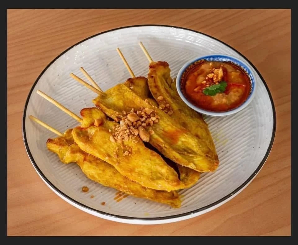 Chicken satay skewers with dipping sauce